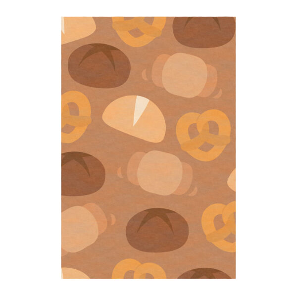Tapis touffeté aux tons chauds représentant des produits de boulangerie abstraits, notamment des bretzels, des miches de pain et des petits pains dans beige et de brun.