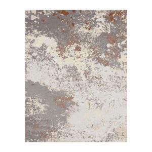 Tapis touffeté abstrait présentant des motifs éclaboussés dans des tons crème, gris et rouille. Le design texturé crée une apparence moderne, picturale.
